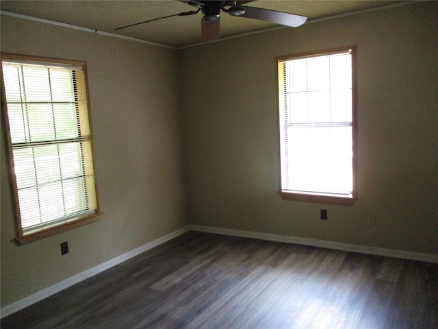 261 Airport Rd, Emory, TX 75440 - unfurnished room with plenty of natural light, a ceiling fan, dark wood-type flooring, and baseboards