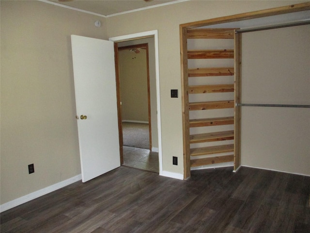 261 Airport Rd, Emory, TX 75440 - unfurnished bedroom featuring wood finished floors, baseboards, crown molding, and a closet