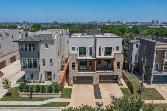 1021 Mobile St, Dallas, TX 75208 - view of building exterior featuring an attached garage and concrete driveway