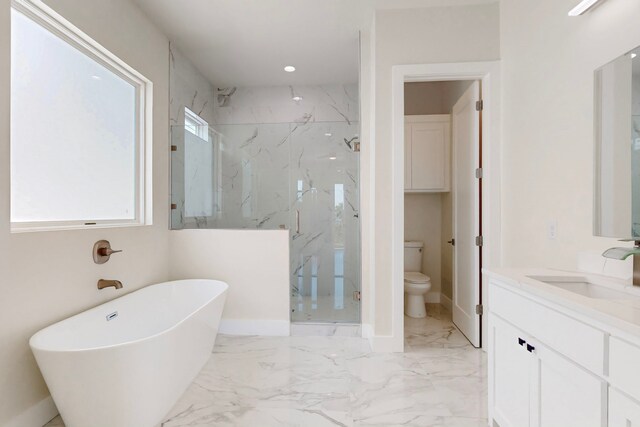 1021 Mobile St, Dallas, TX 75208 - bathroom featuring a marble finish shower, vanity, a freestanding tub, toilet, and marble finish floors