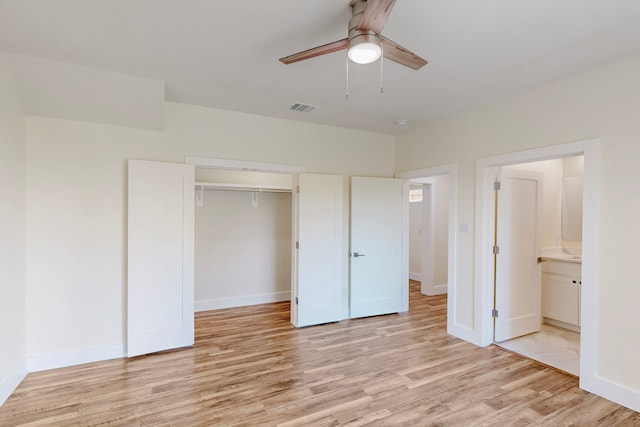 1021 Mobile St, Dallas, TX 75208 - unfurnished bedroom with light wood finished floors, a closet, baseboards, and a ceiling fan