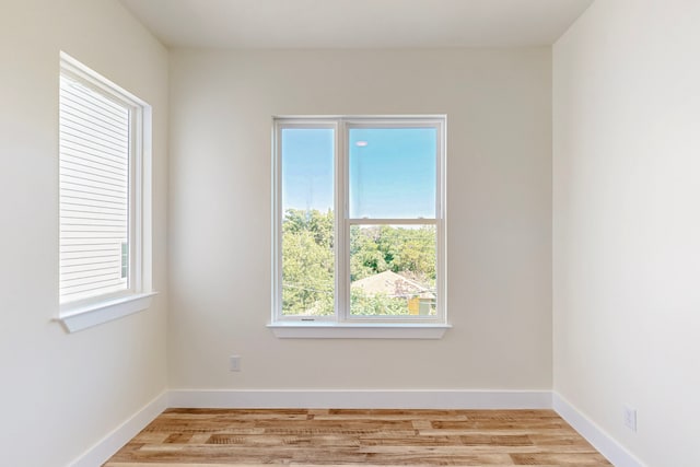 1021 Mobile St, Dallas, TX 75208 - spare room with light wood finished floors and baseboards