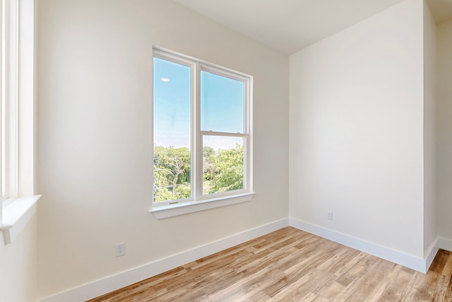 1021 Mobile St, Dallas, TX 75208 - spare room with light wood finished floors and baseboards