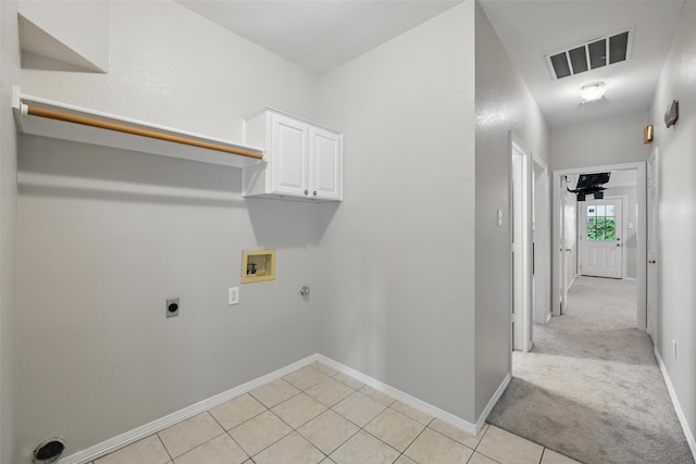 9228 Winslow Ct, North Richland Hills, TX 76182 - laundry area with hookup for a washing machine, cabinet space, gas dryer hookup, hookup for an electric dryer, and baseboards