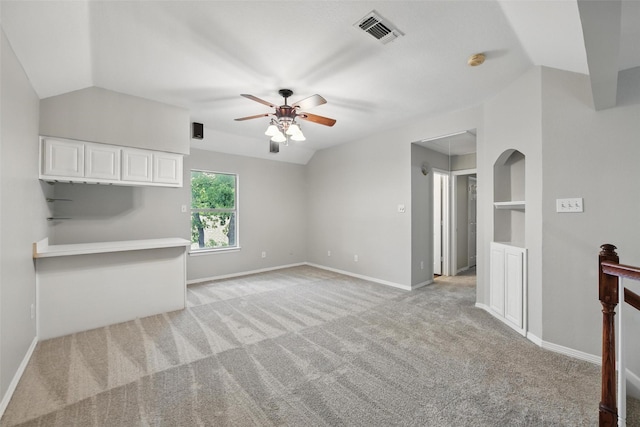 9228 Winslow Ct, North Richland Hills, TX 76182 - unfurnished living room with a ceiling fan, lofted ceiling, light colored carpet, baseboards, and built in features