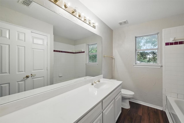9228 Winslow Ct, North Richland Hills, TX 76182 - bathroom featuring baseboards, vanity, plenty of natural light, and wood finished floors