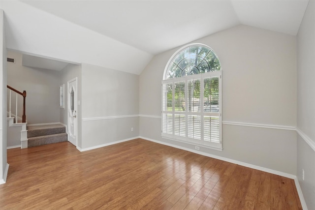 9228 Winslow Ct, North Richland Hills, TX 76182 - spare room with lofted ceiling, wood finished floors, stairs, and baseboards