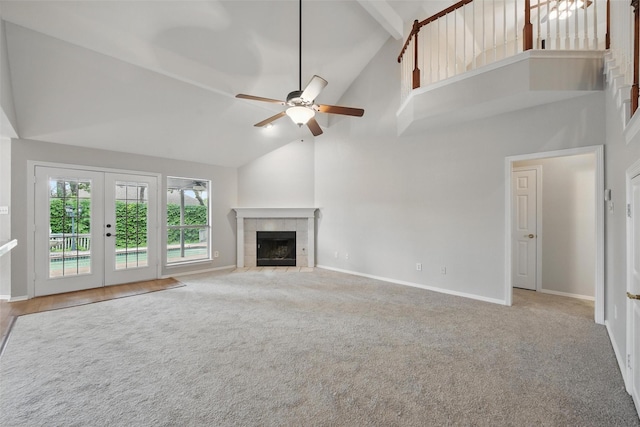 9228 Winslow Ct, North Richland Hills, TX 76182 - unfurnished living room with high vaulted ceiling, a ceiling fan, a tile fireplace, baseboards, and french doors