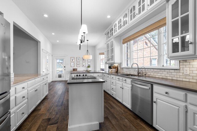 306 Stonecrest Rd, Argyle, TX 76226 - kitchen featuring stainless steel appliances, a sink, backsplash, white cabinets, and recessed lighting