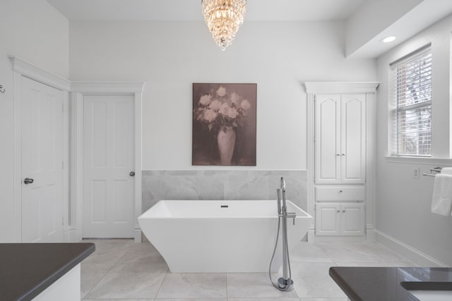 306 Stonecrest Rd, Argyle, TX 76226 - bathroom featuring a freestanding bath, a chandelier, and recessed lighting