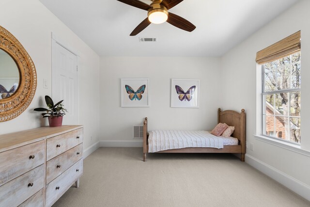 306 Stonecrest Rd, Argyle, TX 76226 - bedroom featuring light carpet, multiple windows, baseboards, and a ceiling fan