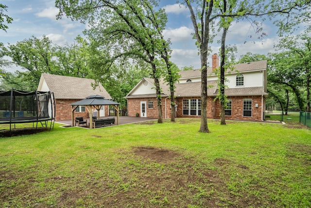 306 Stonecrest Rd, Argyle, TX 76226 - rear view of property with a gazebo, a trampoline, a patio area, and brick siding