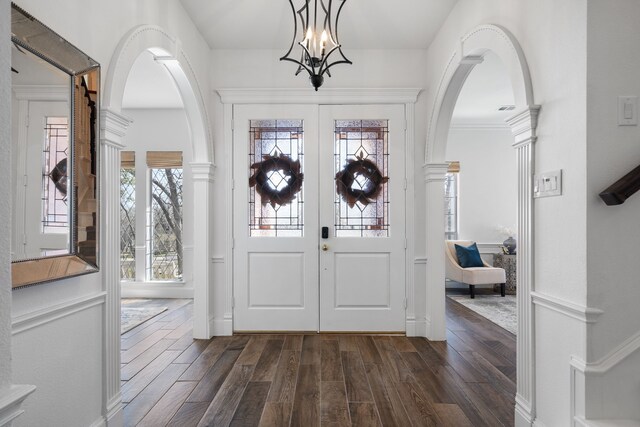 306 Stonecrest Rd, Argyle, TX 76226 - foyer entrance with dark wood-style floors, arched walkways, french doors, and a chandelier