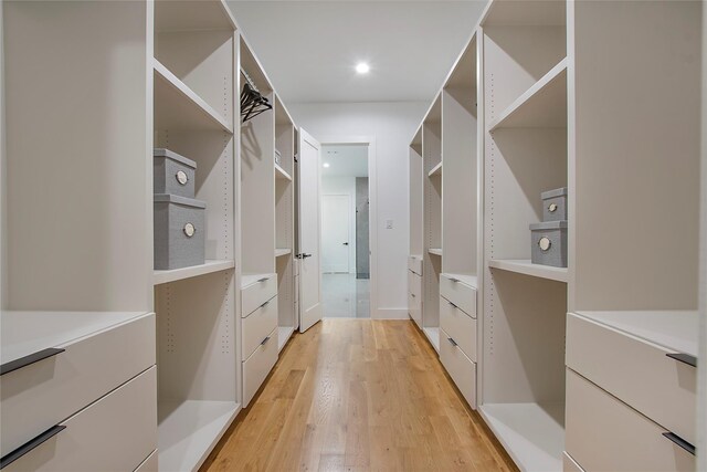 8506 Craighill Ave, Dallas, TX 75209 - walk in closet with light wood-style floors