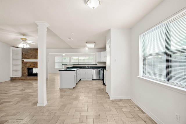 4629 Las Hadas, Mesquite, TX 75150 - kitchen with stainless steel dishwasher, a sink, ceiling fan, dark countertops, and baseboards