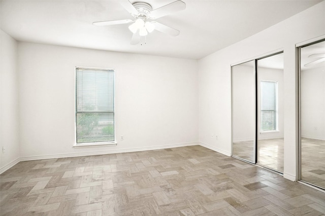 4629 Las Hadas, Mesquite, TX 75150 - unfurnished bedroom with two closets, baseboards, and a ceiling fan
