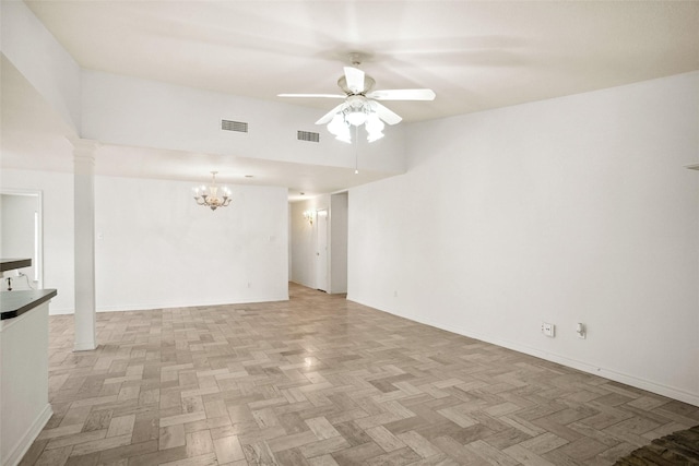 4629 Las Hadas, Mesquite, TX 75150 - unfurnished room featuring a chandelier, a ceiling fan, baseboards, and ornate columns