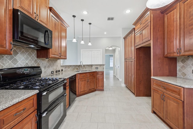 9718 Prestmont Pl, Frisco, TX 75035 - kitchen featuring black appliances, a sink, arched walkways, brown cabinetry, and ornamental molding