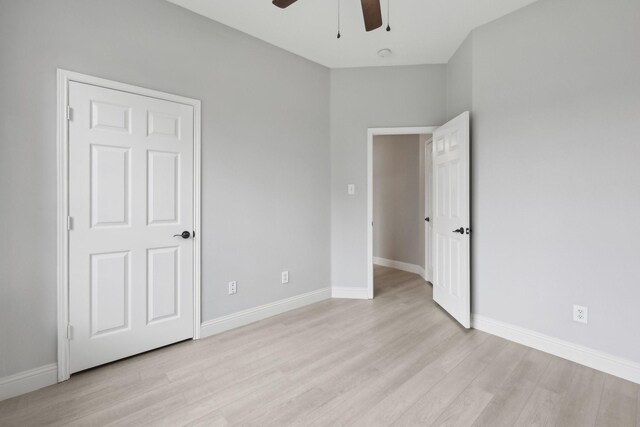9718 Prestmont Pl, Frisco, TX 75035 - unfurnished bedroom featuring light wood finished floors, baseboards, and a ceiling fan