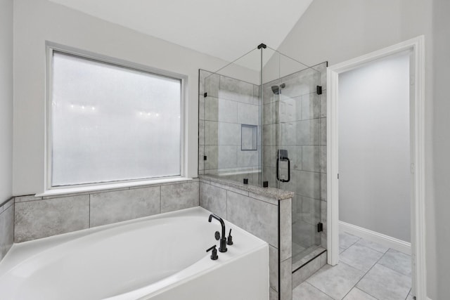 9718 Prestmont Pl, Frisco, TX 75035 - bathroom featuring plenty of natural light, a bath, a stall shower, and baseboards