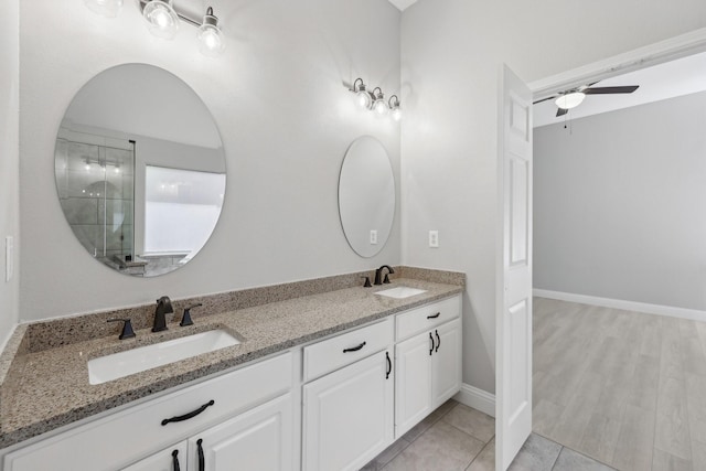 9718 Prestmont Pl, Frisco, TX 75035 - bathroom featuring double vanity, a ceiling fan, and tile patterned flooring