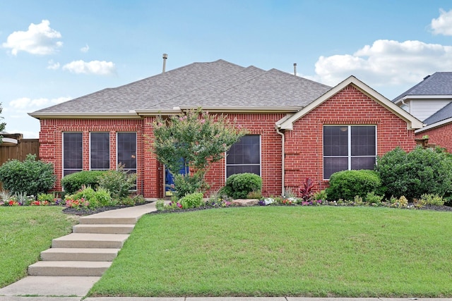9718 Prestmont Pl, Frisco, TX 75035 - view of front of home featuring roof with shingles, brick siding, and a front yard