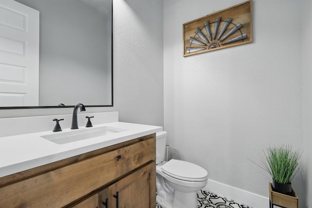 1020 Sky Rd, Weatherford, TX 76087 - bathroom with toilet, vanity, and baseboards