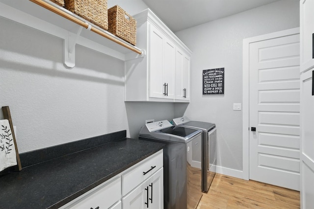 1020 Sky Rd, Weatherford, TX 76087 - laundry area featuring washing machine and dryer, cabinet space, light wood-type flooring, and baseboards