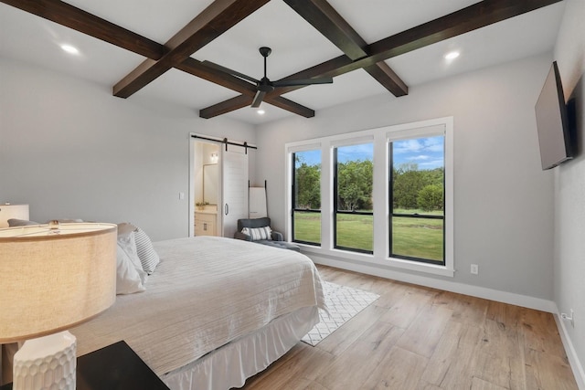 1020 Sky Rd, Weatherford, TX 76087 - bedroom featuring a barn door, coffered ceiling, beam ceiling, light wood finished floors, and baseboards