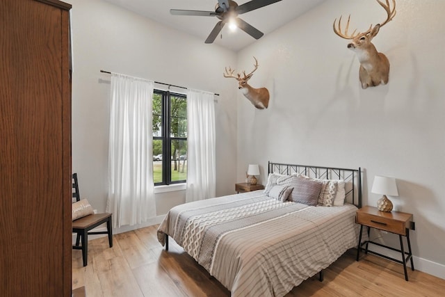 1020 Sky Rd, Weatherford, TX 76087 - bedroom with light wood finished floors, baseboards, and ceiling fan