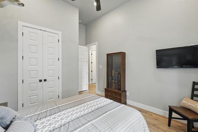 1020 Sky Rd, Weatherford, TX 76087 - bedroom featuring a high ceiling, a closet, wood finished floors, baseboards, and ceiling fan