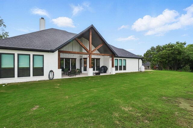 1020 Sky Rd, Weatherford, TX 76087 - back of property featuring a patio area, a lawn, roof with shingles, and a chimney