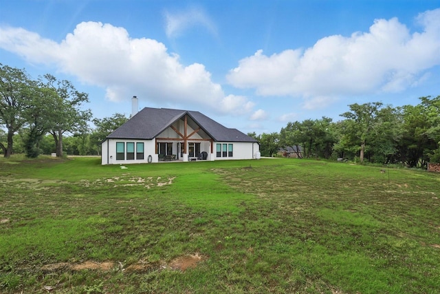 1020 Sky Rd, Weatherford, TX 76087 - back of property with a yard and a chimney