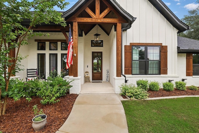 1020 Sky Rd, Weatherford, TX 76087 - property entrance with brick siding, a porch, board and batten siding, and roof with shingles