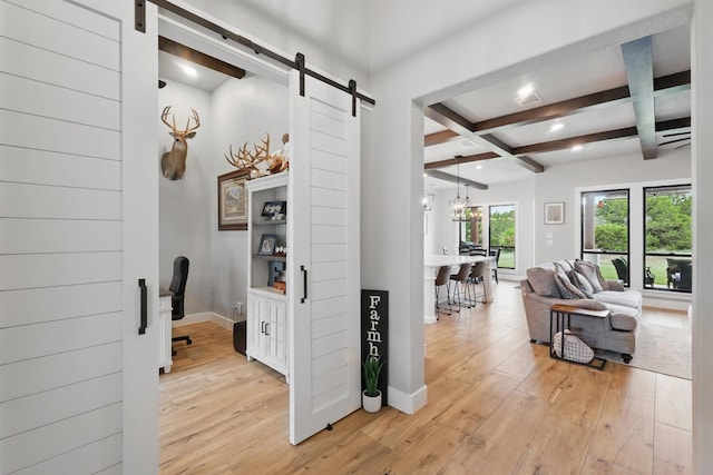 1020 Sky Rd, Weatherford, TX 76087 - hallway featuring a barn door, light wood-style flooring, coffered ceiling, beamed ceiling, and baseboards