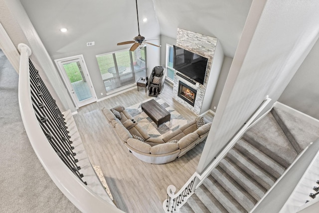 3723 Parkwood Ln, Denison, TX 75020 - living room with ceiling fan, baseboards, wood finished floors, vaulted ceiling, and a glass covered fireplace
