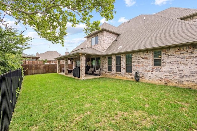 3723 Parkwood Ln, Denison, TX 75020 - rear view of property featuring a patio, brick siding, and roof with shingles
