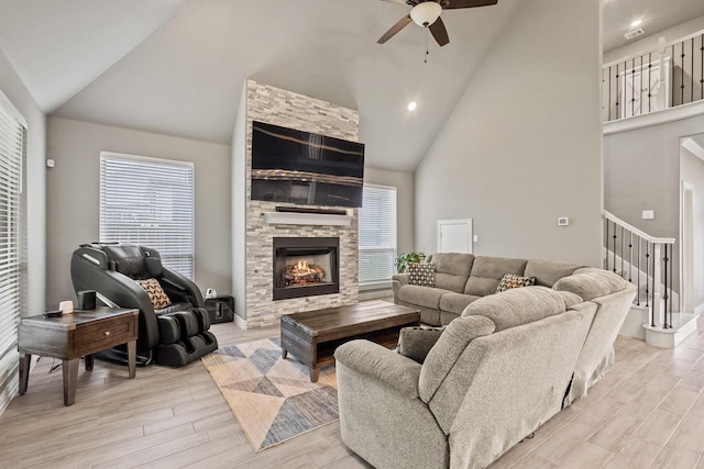 3723 Parkwood Ln, Denison, TX 75020 - living area with ceiling fan, light wood-style flooring, high vaulted ceiling, a fireplace, and recessed lighting
