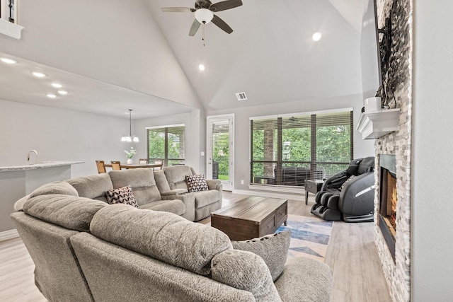 3723 Parkwood Ln, Denison, TX 75020 - living area with recessed lighting, plenty of natural light, ceiling fan, a stone fireplace, and high vaulted ceiling