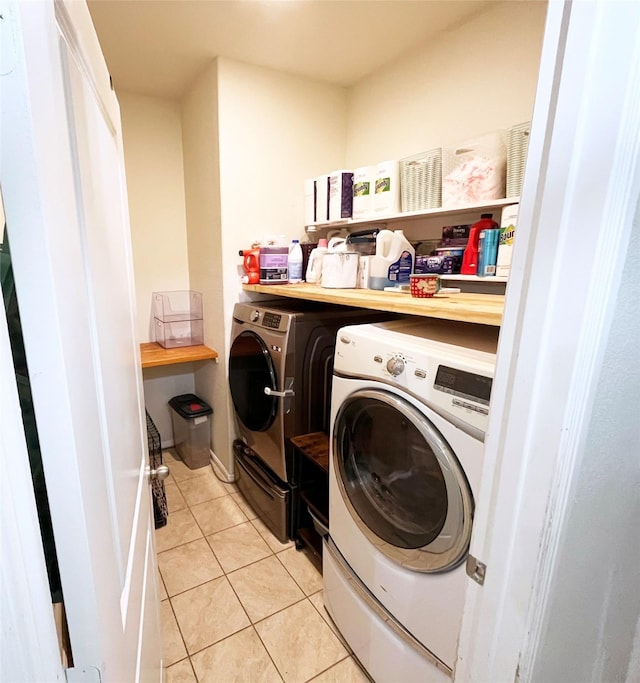 328 Foxhunter St, Fort Worth, TX 76131 - washroom with washing machine and clothes dryer and light tile patterned floors