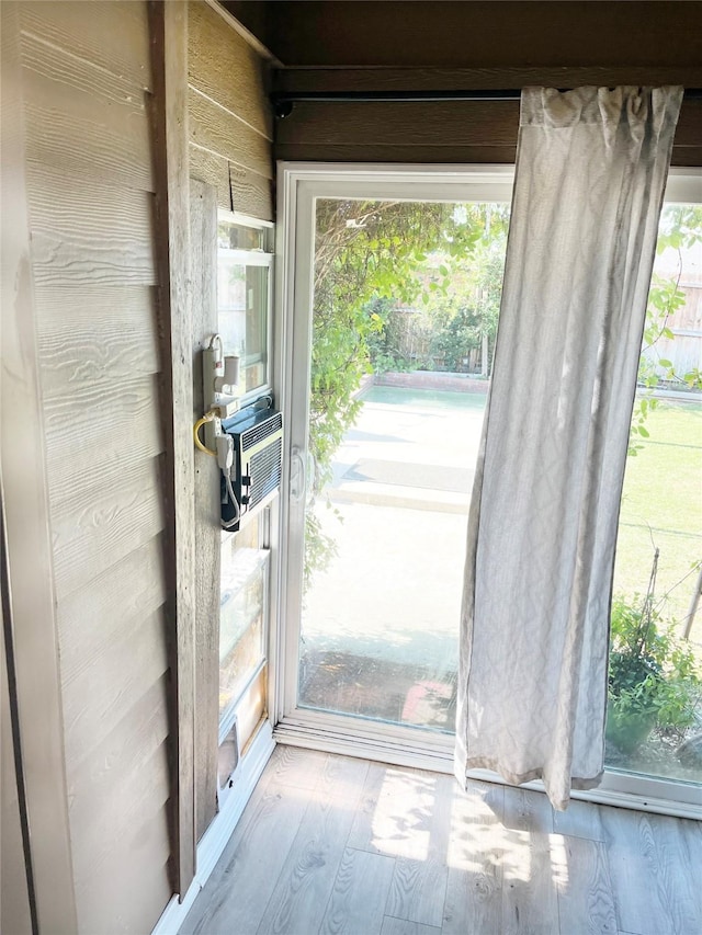 328 Foxhunter St, Fort Worth, TX 76131 - doorway with healthy amount of natural light, wood finished floors, and cooling unit