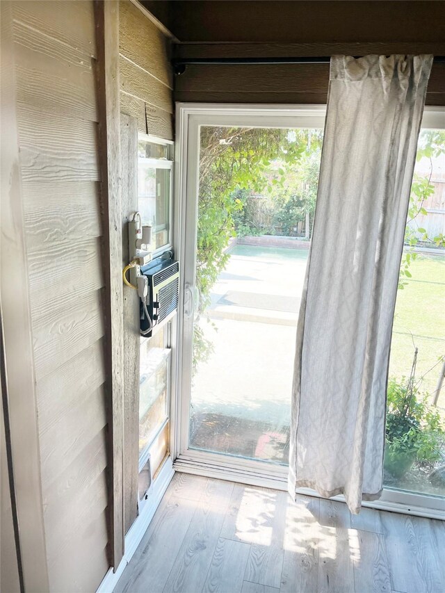 328 Foxhunter St, Fort Worth, TX 76131 - doorway with healthy amount of natural light, wood finished floors, and cooling unit