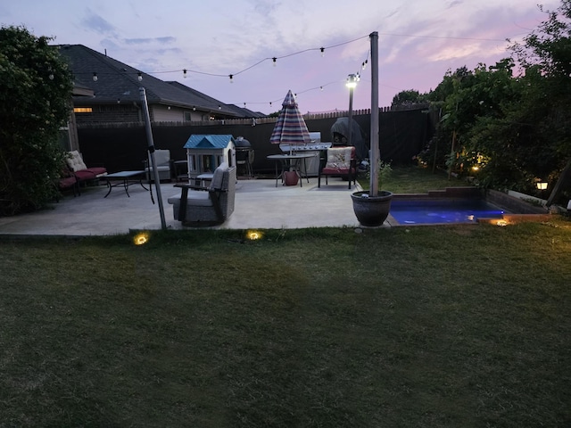 328 Foxhunter St, Fort Worth, TX 76131 - yard at dusk with a patio and an outdoor pool