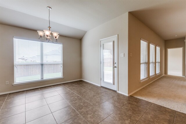 905 Ridge Dr, Little Elm, TX 75068 - unfurnished dining area with a chandelier, tile patterned flooring, vaulted ceiling, and baseboards