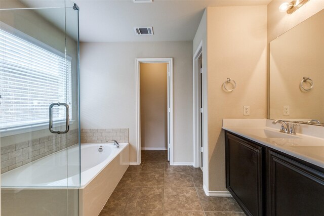 905 Ridge Dr, Little Elm, TX 75068 - full bath featuring vanity, a garden tub, and tile patterned flooring
