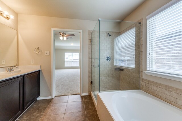 905 Ridge Dr, Little Elm, TX 75068 - bathroom with vanity, a garden tub, a stall shower, ceiling fan, and tile patterned flooring