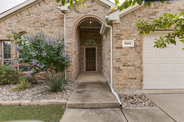905 Ridge Dr, Little Elm, TX 75068 - entrance to property with an attached garage and brick siding