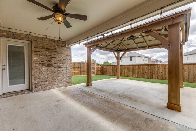 905 Ridge Dr, Little Elm, TX 75068 - fenced backyard with a gazebo, a ceiling fan, and a patio