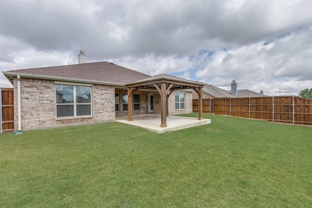 905 Ridge Dr, Little Elm, TX 75068 - back of house featuring a chimney, a patio area, roof with shingles, brick siding, and a gazebo