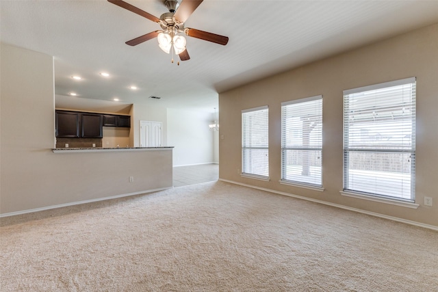 905 Ridge Dr, Little Elm, TX 75068 - unfurnished living room featuring a ceiling fan, healthy amount of natural light, carpet floors, recessed lighting, and baseboards